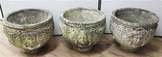 A set of three reconstituted stone garden urns, Diam. 1ft 8in. H.1ft 6in.